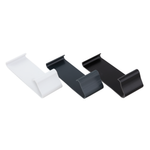 A white, an antrachite grey, and a black edge trim clip lying face up.