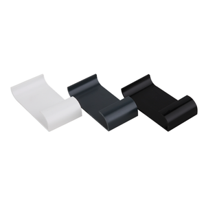 A white, an antrachite grey, and a black gutter trim clip lying face up.